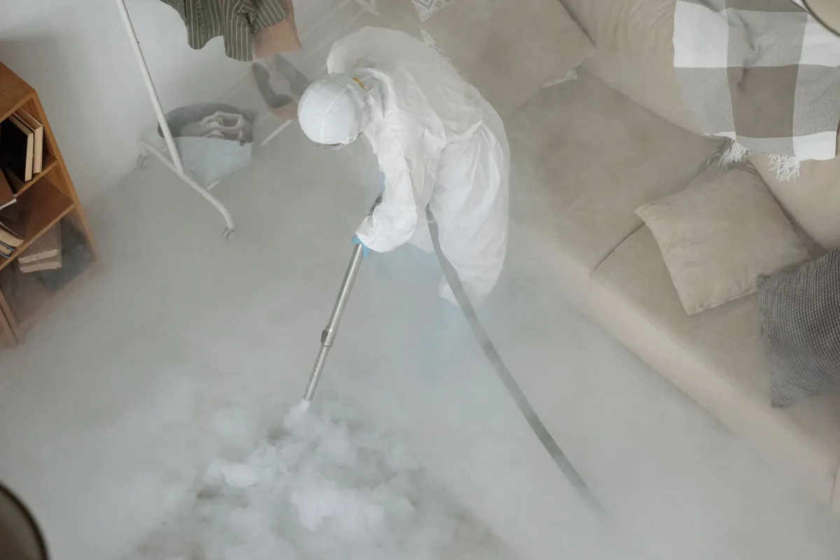 Biohazard cleanup technician in protective equipment, San Diego, TX